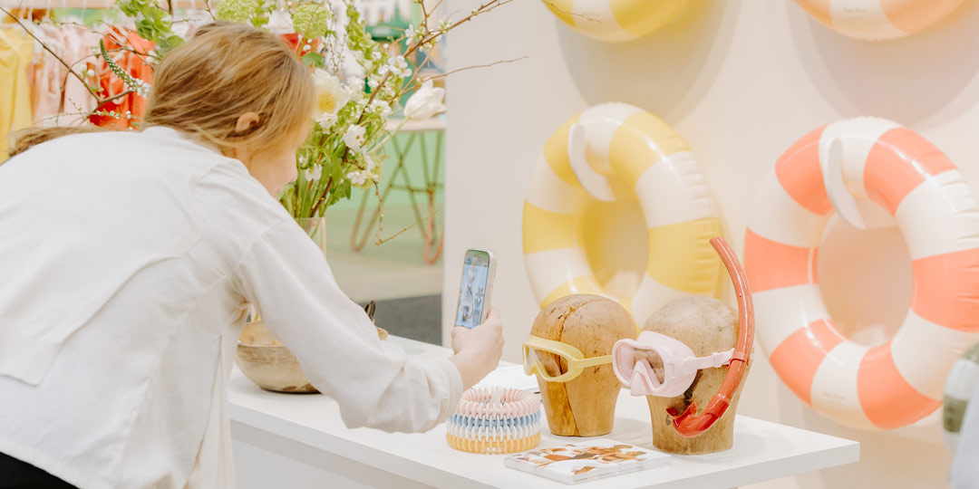 woman photographing cyclops and snorkel at formex booth